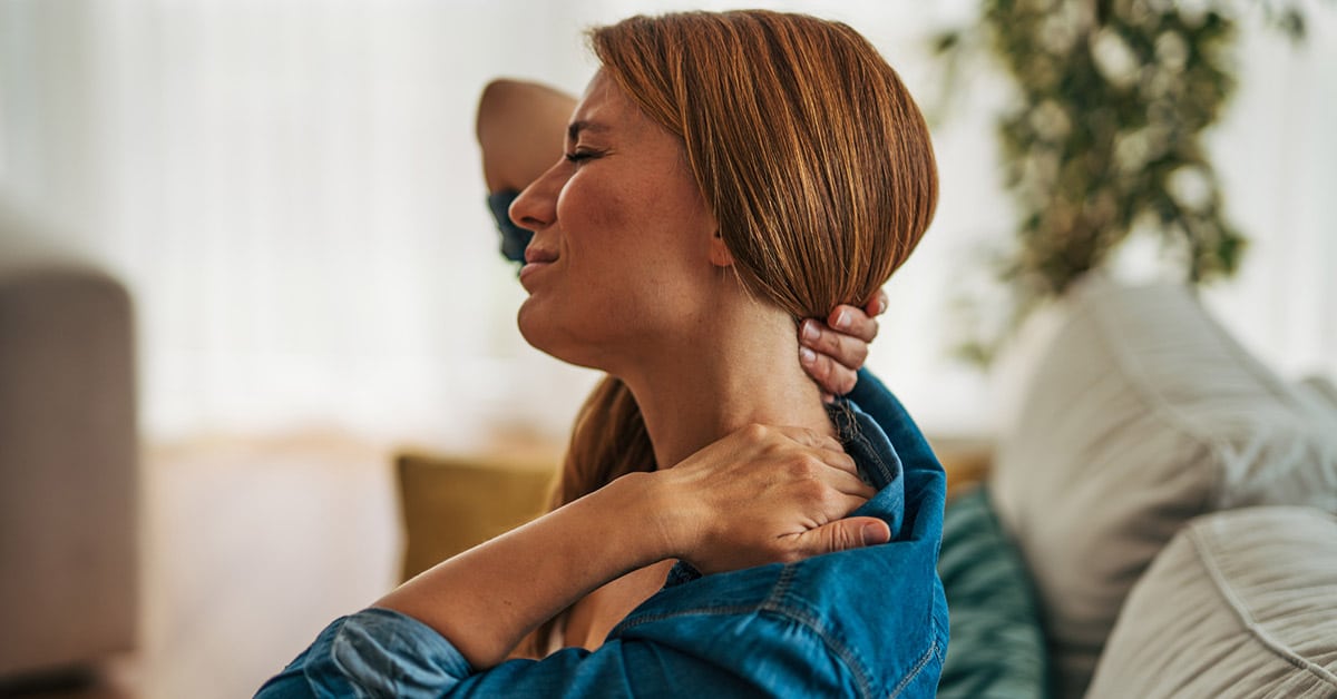 woman having whiplash pain