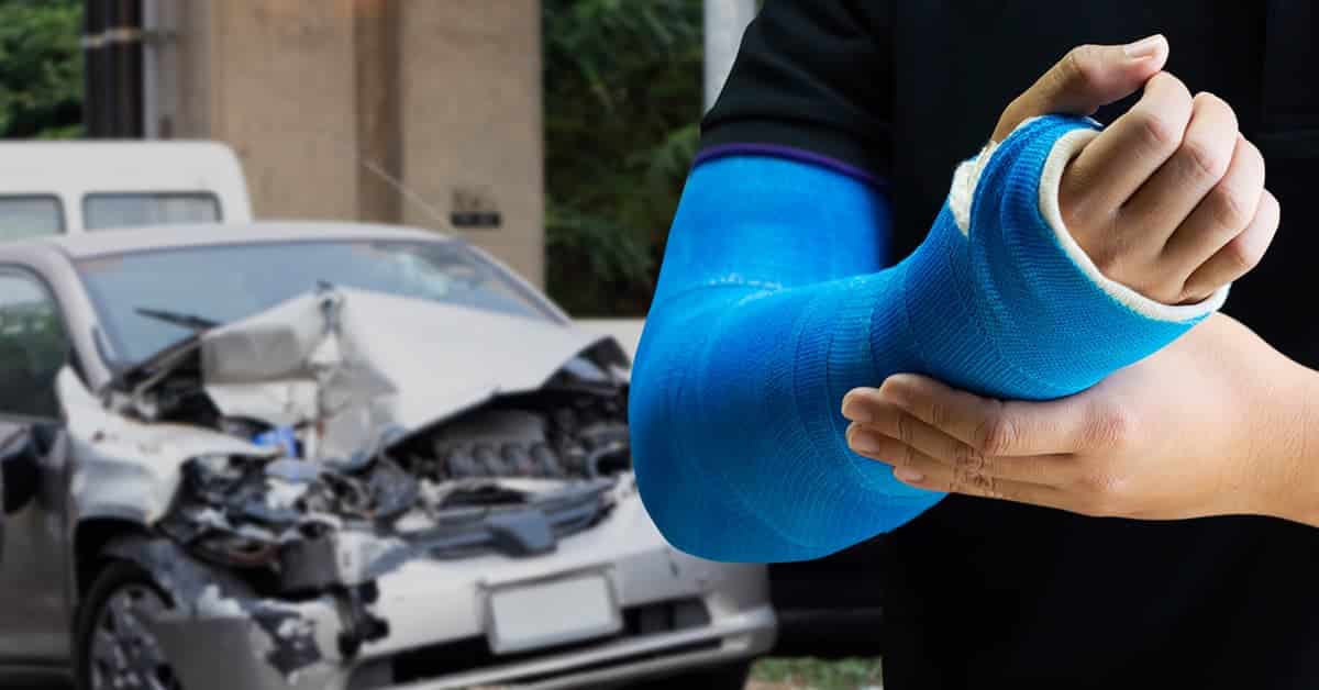 Man holding hand with blue bandage as arm injury concept with car accident