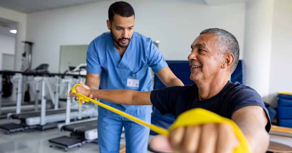 Man doing physical therapy exercises using a stretch band
