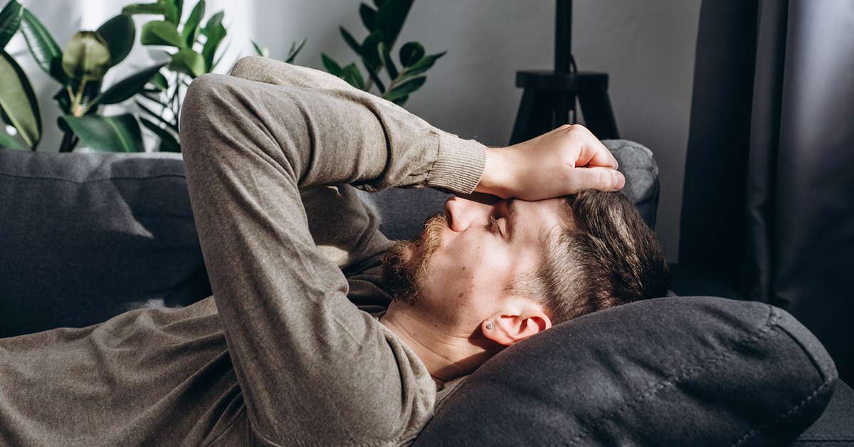 man with a headache after a car accident